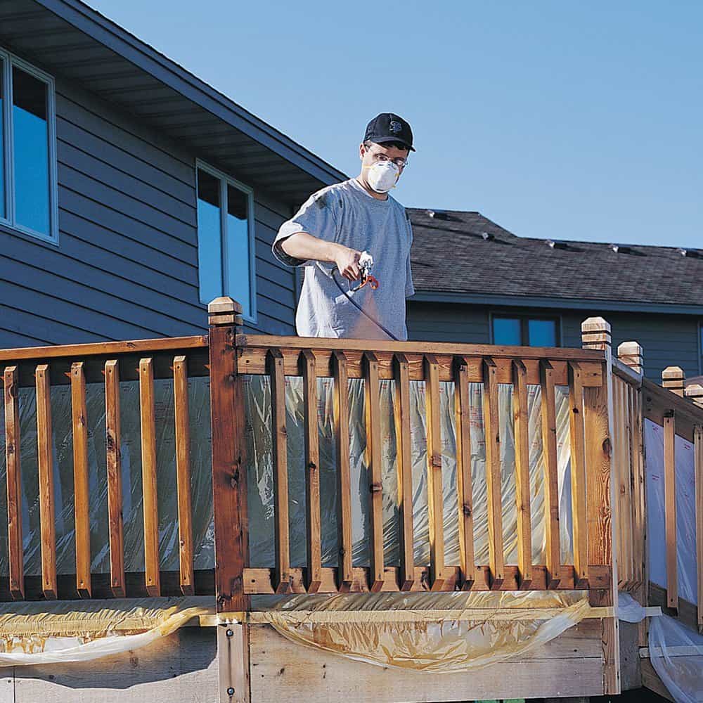 Person using a great airless paint sprayer by Graco 