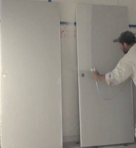 paint sprayer on wooden door
